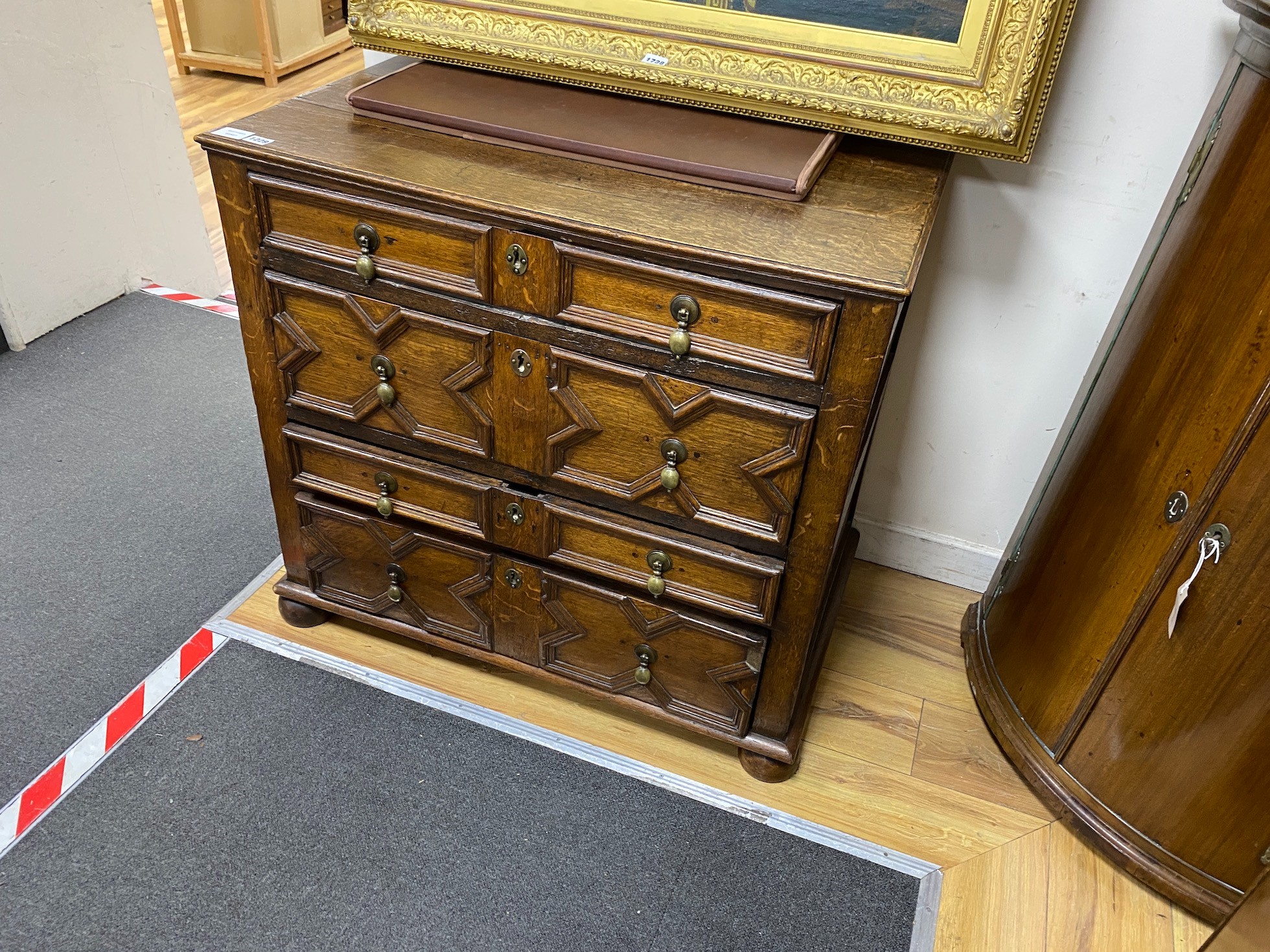 A 17th century oak geometric chest, width 87cm, depth 54cm, height 80cm